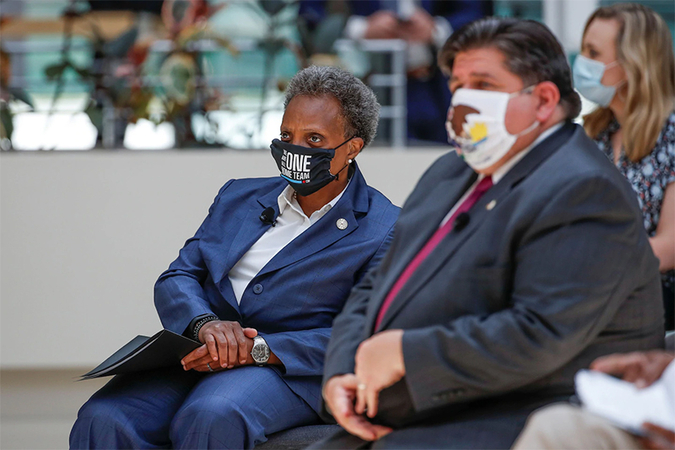 Chicago Mayor Lori Lightfoot and Illinois Gov. J.B. Pritzker at the announcement of the quantum Internet project on Thursday. (Kamil Krzaczynski/Reuters)