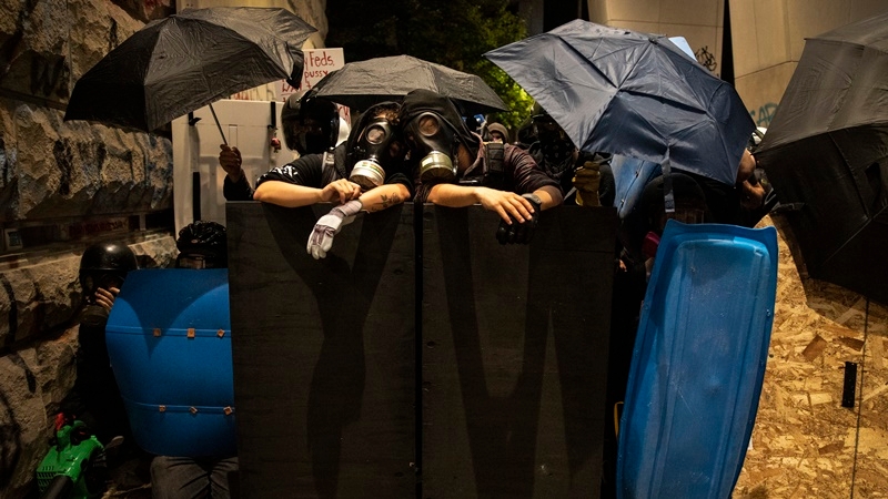 Protesters have worn helmets, goggles and face masks and carried homemade shields as protection from the tear gas and munitions federal agents are using in Portland. The agents' presence has angered state and local leaders, who say they were not told of the deployment to the restive city ahead of the July 4 holiday. MUST CREDIT: Photo for The Washington Post by Paula Bronstein