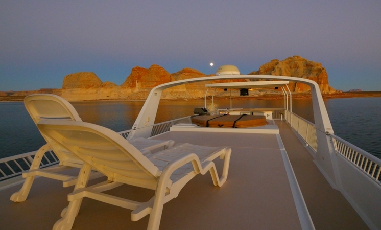 Vacationers take to the water at a safe distance aboard rented houseboats Vacationers take to the water at a safe distance aboard rented houseboats