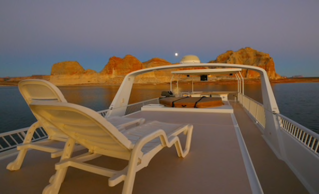 Vacationers take to the water at a safe distance aboard rented houseboats Vacationers take to the water at a safe distance aboard rented houseboats