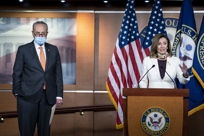 House Speaker Nancy Pelosi, D-Calif., speaks while Senate Minority Leader Chuck Schumer, D-N..Y., listens during a news conference on Capitol Hill in Washington on Aug. 6, 2020. MUST CREDIT: Bloomberg photo by Sarah Silbiger.
Location: Washington, United States