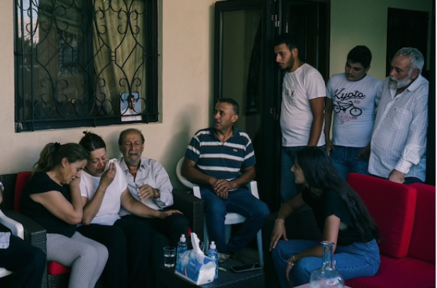 Charbel Hitti's mother, second from left, sits next to Charbel Karam's father as they cry for the young men feared lost in the blast. Hitti, 22, and cousin Najib Hitti, 20, were firefighters along with Karam, 32, their uncle. The three grew up as best friends in the village of Qartaba. CREDIT: Photo by Lorenzo Tugnoli for The Washington Post