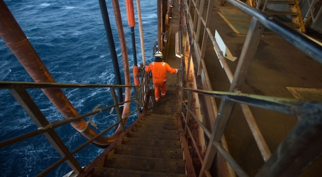 An employee walks down stairs on the Armada gas condensate platform operated by BG Group in the North Sea off the coast of Aberdeen, Scotland, on Dec. 10, 2015. MUST CREDIT: Bloomberg photo by Simon Dawson.
