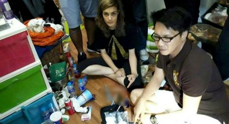 File photo: Actress Amelia Jacobs and her boyfriend Poonyawat Hirantecha watch as police search their Bangkok home.