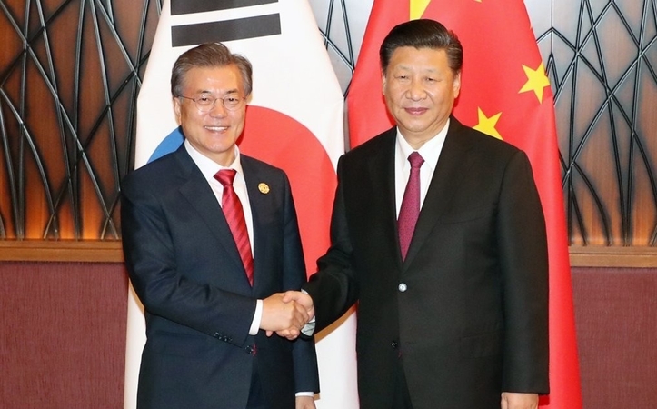 Xi visit aimed at winning over Korea amid feud with US: experts Xi visit aimed at winning over Korea amid feud with US: experts