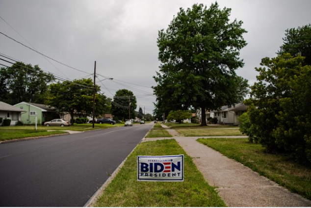 A yard sign in support of Democratic presidential candidate Joe Biden decorates a yard in the suburb of Erie, Pa.  CREDIT: Washington Post photo by Salwan Georges.
