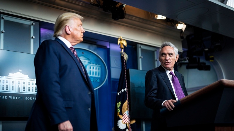 Scott Atlas, senior fellow at the Hoover Institution, speaks with President Trump during a coronavirus briefing on Aug 12, 2020. MUST CREDIT: Washington Post photo by Jabin Botsford.