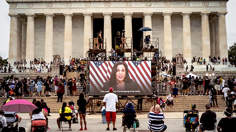 Democratic vice-presidential candidate Kamala Harris appears on a screen during the 