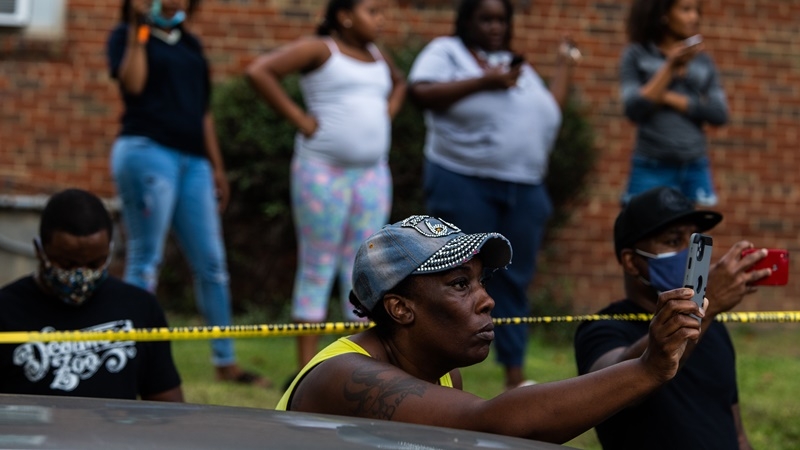 Locals record a news conference on Wednesday, Sept. 3, 2020, regarding a fatal police shooting in Washington two days prior. MUST CREDIT: Washington Post photo by Demetrius Freeman