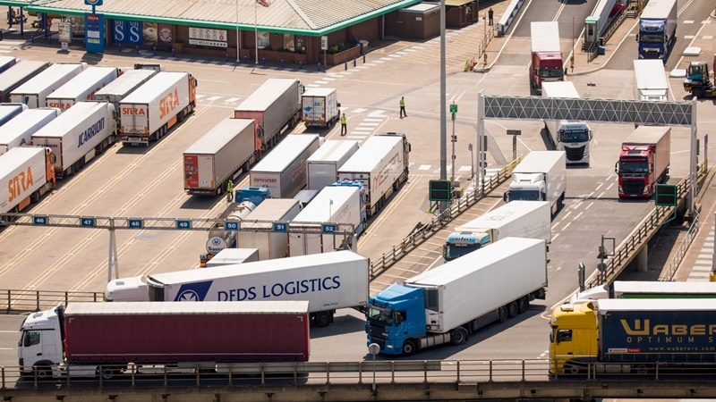 Trucks come off of and drive away from a ferry at the Port of Dover in England on May 27, 2020. The U.K. announced its post-Brexit tariffs regime, cutting import duties on many products while protecting industries such as automotive and agriculture, as the country turns its focus toward global trade beyond Europe. MUST CREDIT: Bloomberg photo by Jason Alden