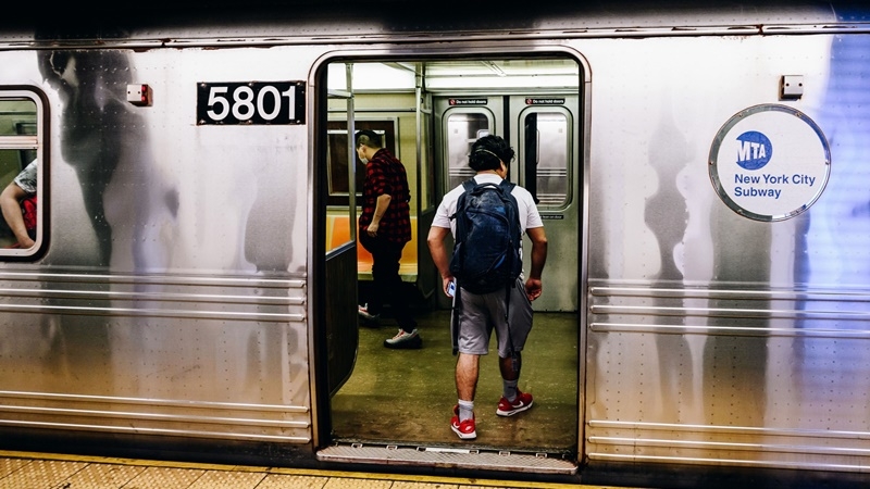 Commuters enter a New York subway train in June 2020. MUST CREDIT: Bloomberg photo by Nina Westervelt