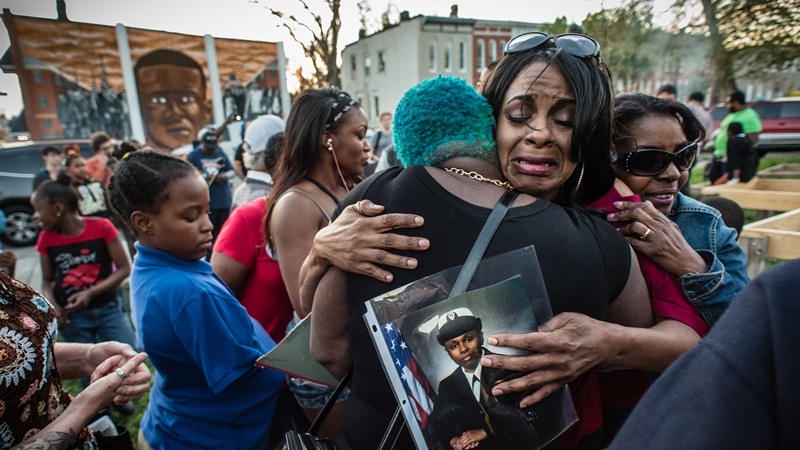 Gina Best embraces friends and supporters after an event in Baltimore on April 19, 2016, to mark the anniversary of Freddie Gray's death in police custody. Best spoke about her daughter, India Kager, who was fatally shot in September 2015 by police in Virginia Beach, Va. MUST CREDIT: Photo for The Washington Post by Andre Chung