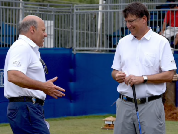 Louis DeJoy pictured with then-North Carolina Gov. Pat McCrory at the 2015 Wyndham Championship.  CREDIT: Randy Harris