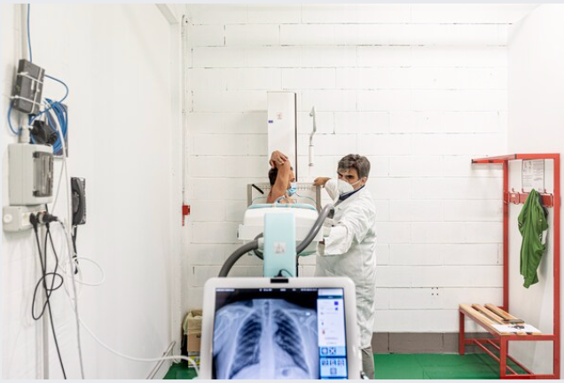 A patient gets an X-ray at a Bergamo, Italy, convention center that was converted for covid-19 patients in the spring and is now used for follow-up care. MUST CREDIT: Photo by Alberto Bernasconi for The Washington Post.
