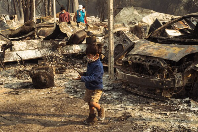 Residents sift through the rubble of their home in Phoenix, Ore., on Thursday, Sept. 10, 2020. MUST CREDIT: Photo for The Washington Post by Mason Trinca