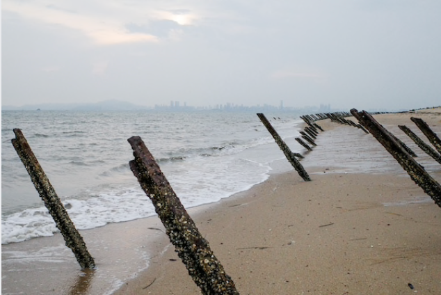 Anti-landing barricades protect Kinmen from Chinese invasion. The mainland city of Xiamen rises from across a channel that was previously filled with undersea mines. MUST CREDIT: Washington Post photo by Gerry Shih.
