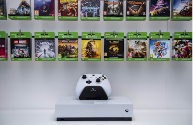 An Xbox One controller sits on display below gaming passes at a Microsoft store in London on July 9, 2019. CREDIT: Bloomberg photo by Chris J. Ratcliffe.
