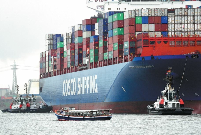A container ship operated by China COSCO Shipping Corp sits fully laden at the port of Hamburg, Germany, in March. China is the European Union's largest source of imports and its second-biggest export market. [Photo/Agencies]