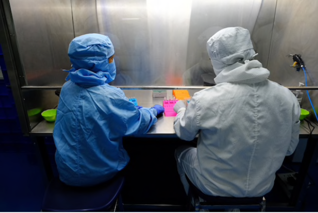Lab technicians produce covid-19 diagnostic kits in a laboratory at the Newtech Medical Devices facility in Faridabad, Haryana, India, on July 15, 2020. MUST CREDIT: Bloomberg photo by T. Narayan.