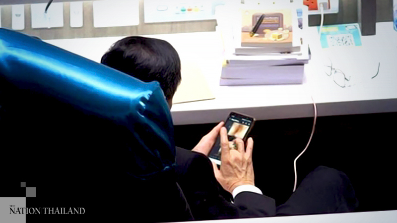 MP pictured looking at adult video: MP pictured looking at adult video: