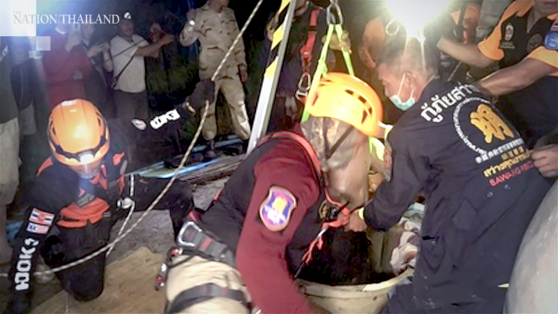 Rescue staff pull three bodies out of deep well Rescue staff pull three bodies out of deep well