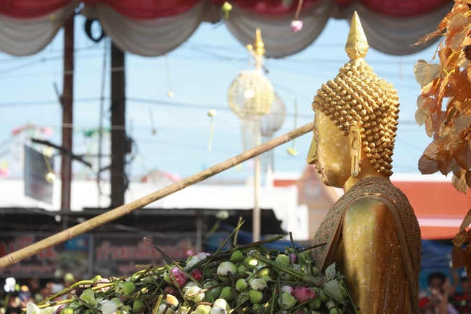 Buddhist devotees come together for lotus-throwing fest despite restrictions Buddhist devotees come together for lotus-throwing fest despite restrictions