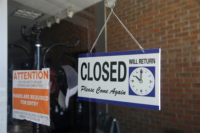 In July, a closed sign hangs in the window of a barber shop in Burbank, Calif, California lost more than 2,6 million jobs in March and April because of the
coronavirus. (Marcio Jose Sanchez/ AP)