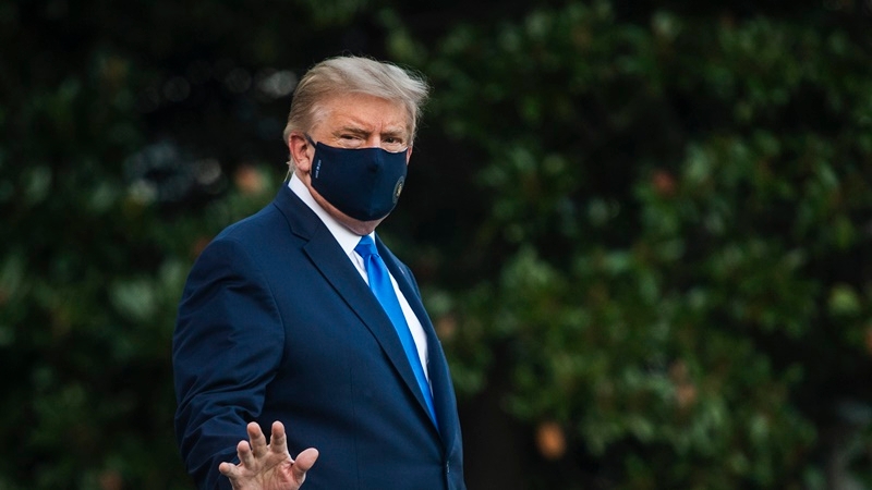 President Donald Trump walks to Marine One on the South Lawn of the White House on Friday afternoon en route to Walter Reed Military Medical Center. After testing positive for the novel coronavirus, Trump remained Saturday at the military hospital. MUST CREDIT: Photo by Amanda Voisard for The Washington Post