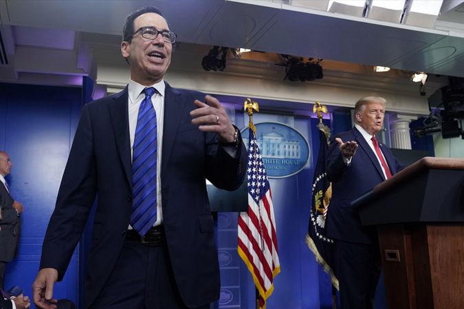 President Trump and Treasury Secretary Steven Mnuchin at a news conference at the White House in August. (Andrew Harnik/ AP)