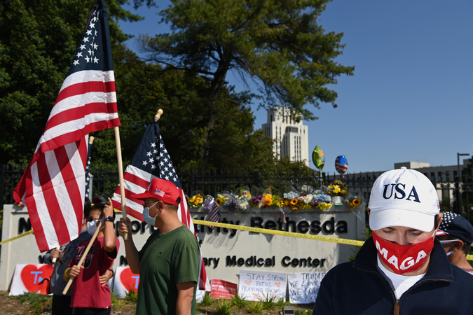 Trump supporters gather outside Walter Reed National Military Medical Center on Sunday, Oct. 4, 2020, in Bethesda, Md. President Donald Trump flew to Walter Reed on Friday to be treated for the novel coronavirus. MUST CREDIT: Washington Post photo by Matt McClain