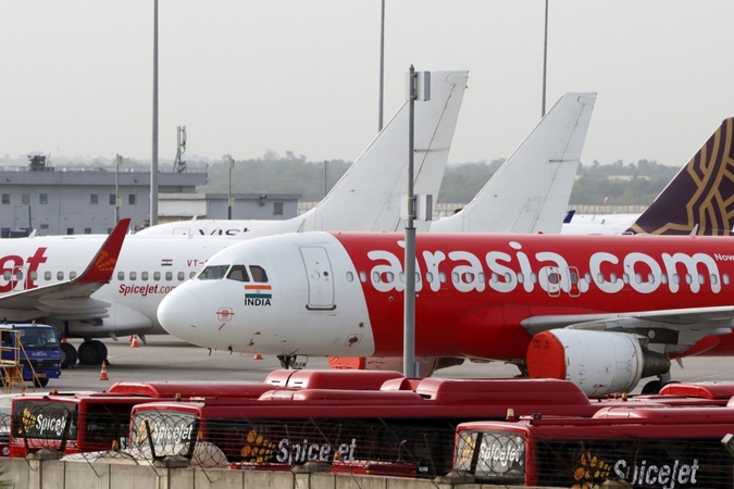 Aircraft operated by AirAsia stand at Indira Gandhi International Airport in New Delhi, India, on June 28, 2020. MUST CREDIT: Bloomberg photo by T. Narayan
/Photo by: T. Narayan — Bloomberg
Location: New Delhi, India