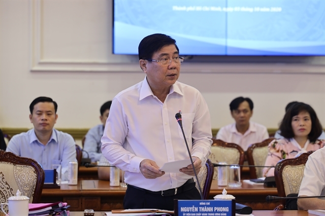 Nguyễn Thành Phong, chairman of the HCM City People’s Committee, speaks at a conference on reviving the city’s economy last week. Photo courtesy of the HCM City Press Centre