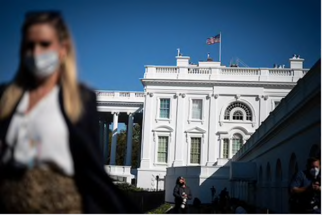 Reporters walk around outside the West Wing on Wednesday in Washington, D.C. Trump remains at the White House after testing positive for covid-19. MUST CREDIT: Washington Post photo by Jabin Botsford
