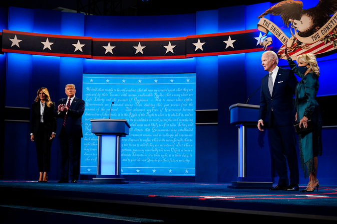 President Donald Trump with first lady Melania Trump and former Vice President Joe Biden with Jill Biden stand on the stage at the conclusion of the first presidential debate at Case Western Reserve University in Cleveland on Sept. 29, 2020. MUST CREDIT: Washington Post photo by Melina Mara