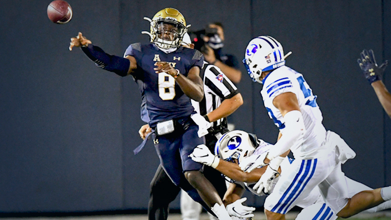 ANNAPOLIS, MD - SEPTEMBER 7: Navy quarterback Dalen Morris (8) throws under pressure during action against Brigham Young at Navy-Marine Corps Memorial Stadium. (Photo by Jonathan Newton /The Washington Post)