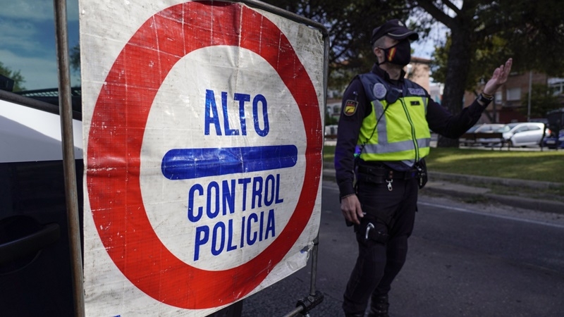 Police man a roadside checkpoint in Madrid, Spain, on Oct. 8, 2020. MUST CREDIT: Bloomberg photo by Paul Hanna.