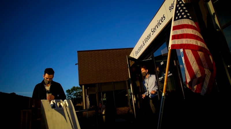 Voters in line outside the Minneapolis Elections & Voters Services building during the first day of early voting Sept. 18. MUST CREDIT: Photo by Joshua Lott for The Washington Post.