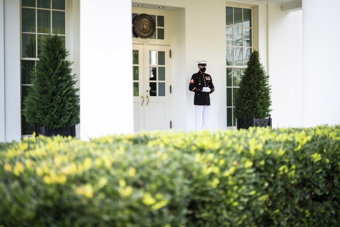 A Marine stands watch outside the West Wing, a sign that the president is in the Oval Office. President Trump is claiming to be cured after his recent bout with covid-19. MUST CREDIT: Washington Post photo by Jabin Botsford
/Photo by: Jabin Botsford — The Washington Post
Location: Washington, United States