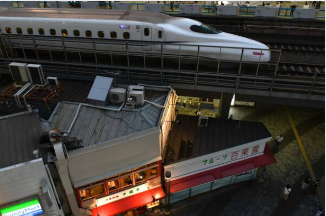 A bullet train travels along an elevated railway track near Yurakucho station in Tokyo on Sept. 8, 2020. MUST CREDIT: Bloomberg photo by Noriko Hayashi.
