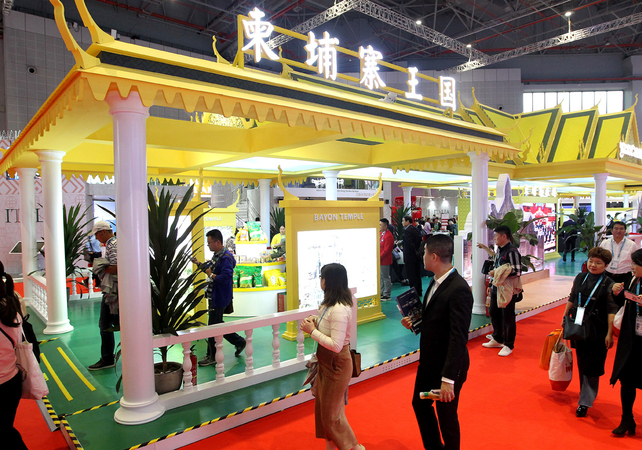Visitors pass the Cambodian pavilion during the second China International Import Expo in Shanghai in November 2019. [Photo/Xinhua]