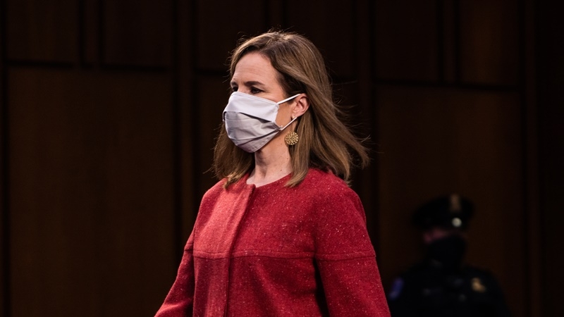 Supreme Court nominee Judge Amy Coney Barrett enters the Senate Judiciary Committee hearing room on Tuesday for day two of hearings on her nomination. MUST CREDIT: Washington Post photo by Demetrius Freeman.