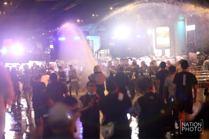 Driven away by water cannons, protesters vow to rally again today