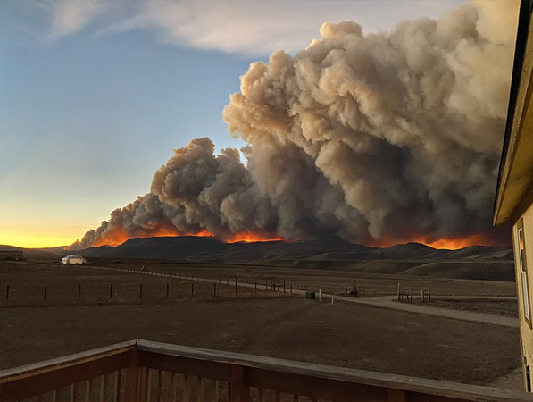 Jessy Ellenberger made this photo from the deck of her home north of Granby, Colo., just before sunset on Wednesday. (Jessy Ellenberger via AP)