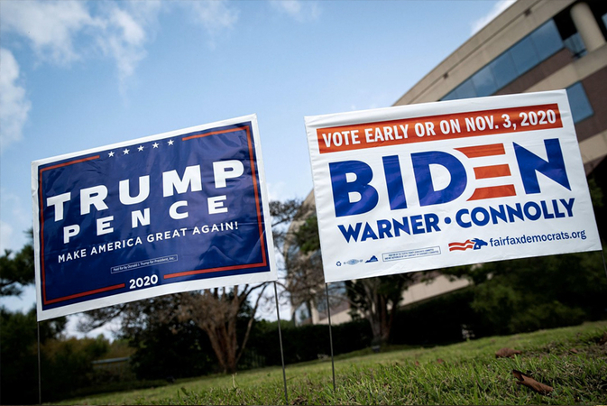 Signs for President Trump and former vice president Joe Biden stand outside the Fairfax County Government Center, an early-voting site. Polling shows
likely voters in Virginia favoring Biden over Trump. (Alexander Drago/ Reuters)