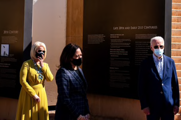 Democratic presidential nominee Joe Biden, vice presidential nominee Kamala Harris (center) and Cindy McCain pay respects to the service of American Indian veterans at the Heard Museum in Phoenix, Ariz., on Oct. 8, 2020. MUST CREDIT: Washington Post photo by Demetrius Freeman