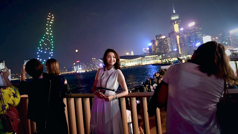 A woman poses for photos in from of Victoria Harbour while attending the opening ceremony of Hong Kong Wine and Dine Festival at Central Harbourfront, Hong Kong, Jan 4, 2019.
Photo Credit: China Daily