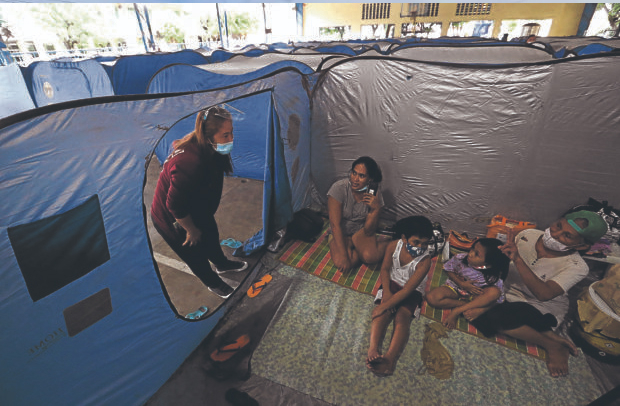 Filipino DOH stresses COVID-19 curbs as 1 million people pack storm shelters Filipino DOH stresses COVID-19 curbs as 1 million people pack storm shelters
