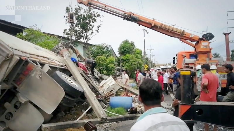 Truck knocks over two electrical poles, damages house Truck knocks over two electrical poles, damages house