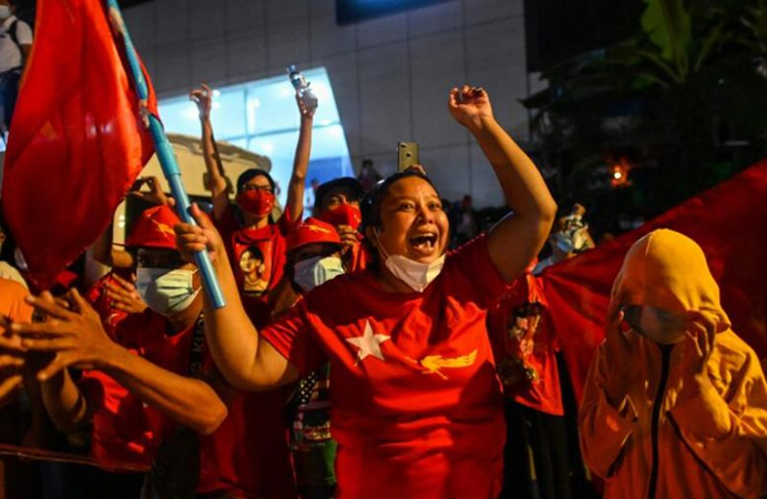 Supporters of the National League for Democracy party react in front of the party's headquarters in Yangon, Myanmar, on Nov 8, 2020. (PHOTO: AFP)