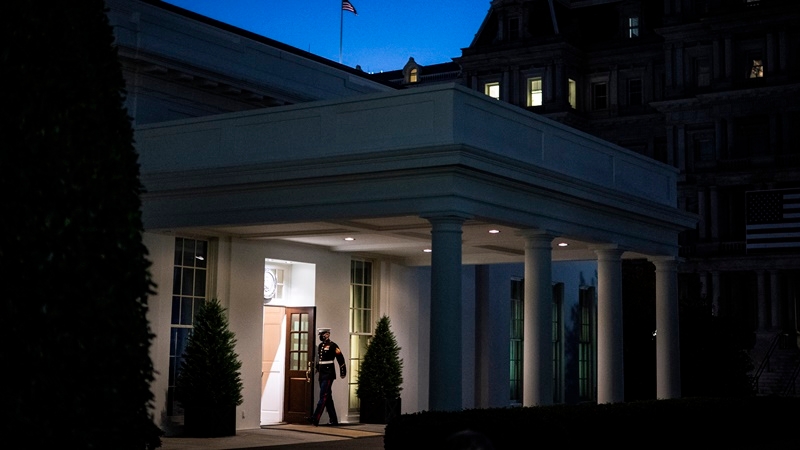 A Marine stands guard outside the West Wing, signifying the President is in the Oval Office, at the White House on Tuesday. MUST CREDIT: Washington Post photo by Jabin Botsford
